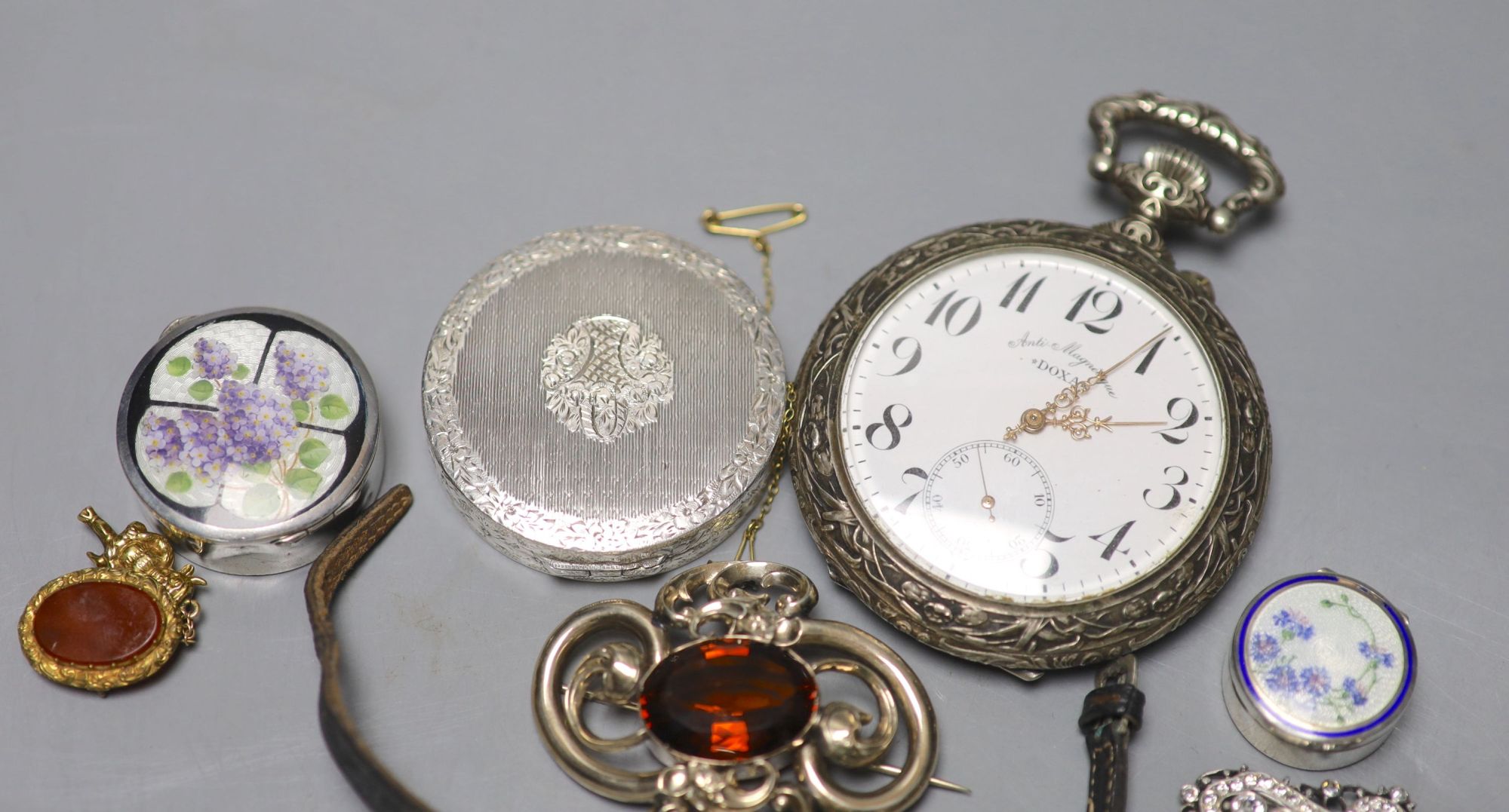 Two white metal and enamel pill boxes including one silver, a ladys 800 standard Baume wrist watch, Doxa pocket watch etc.